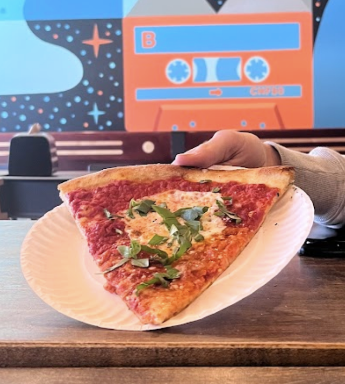A slice of margarita pizza from Dragon Pizza in Davis Square.